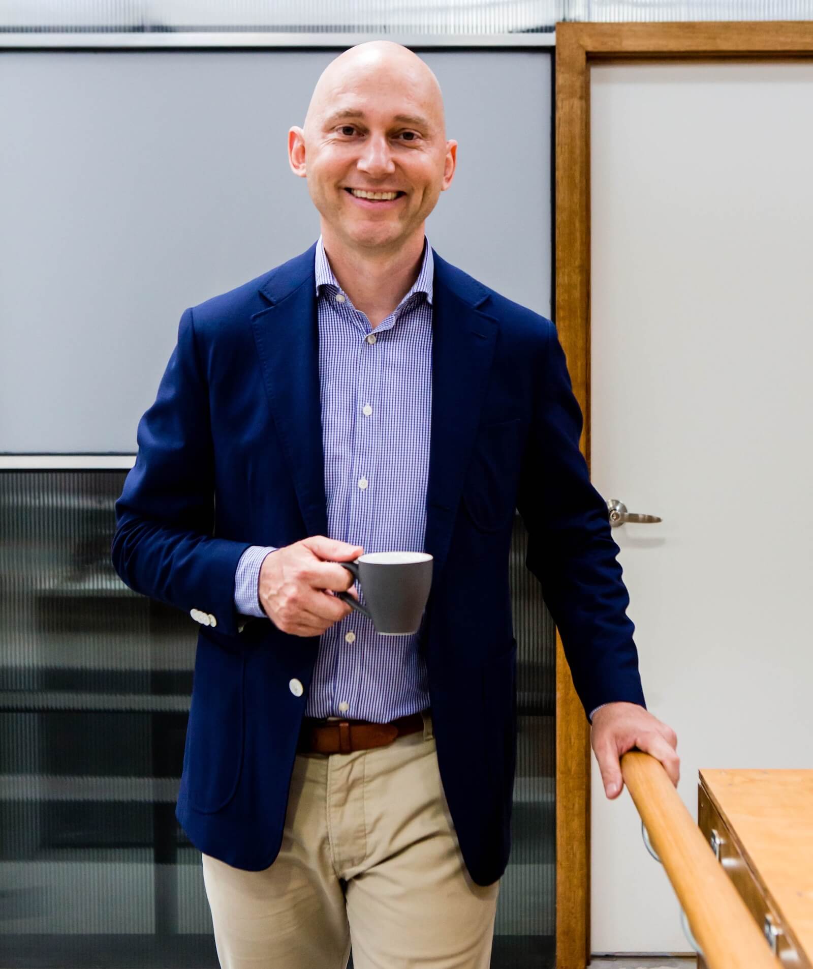 Aptum Managing Director Nigel Evans holding a coffee in the office
